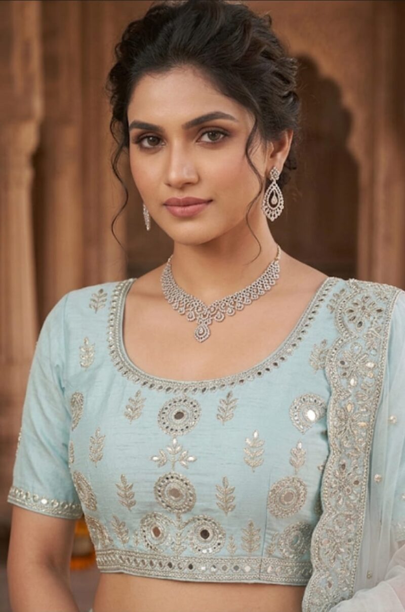aqua-blue-designer-lehenga-closeup Closeup view of aqua blue embroidered lehenga choli