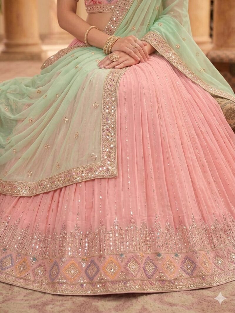 Closeup view of blush pink lehenga embroidery and sequin detailing