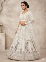 Ivory heritage embroidered lehenga with peacock motifs and net dupatta