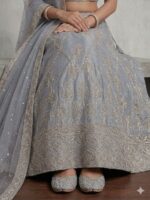 Closeup of embroidered border on moonstone grey lehenga